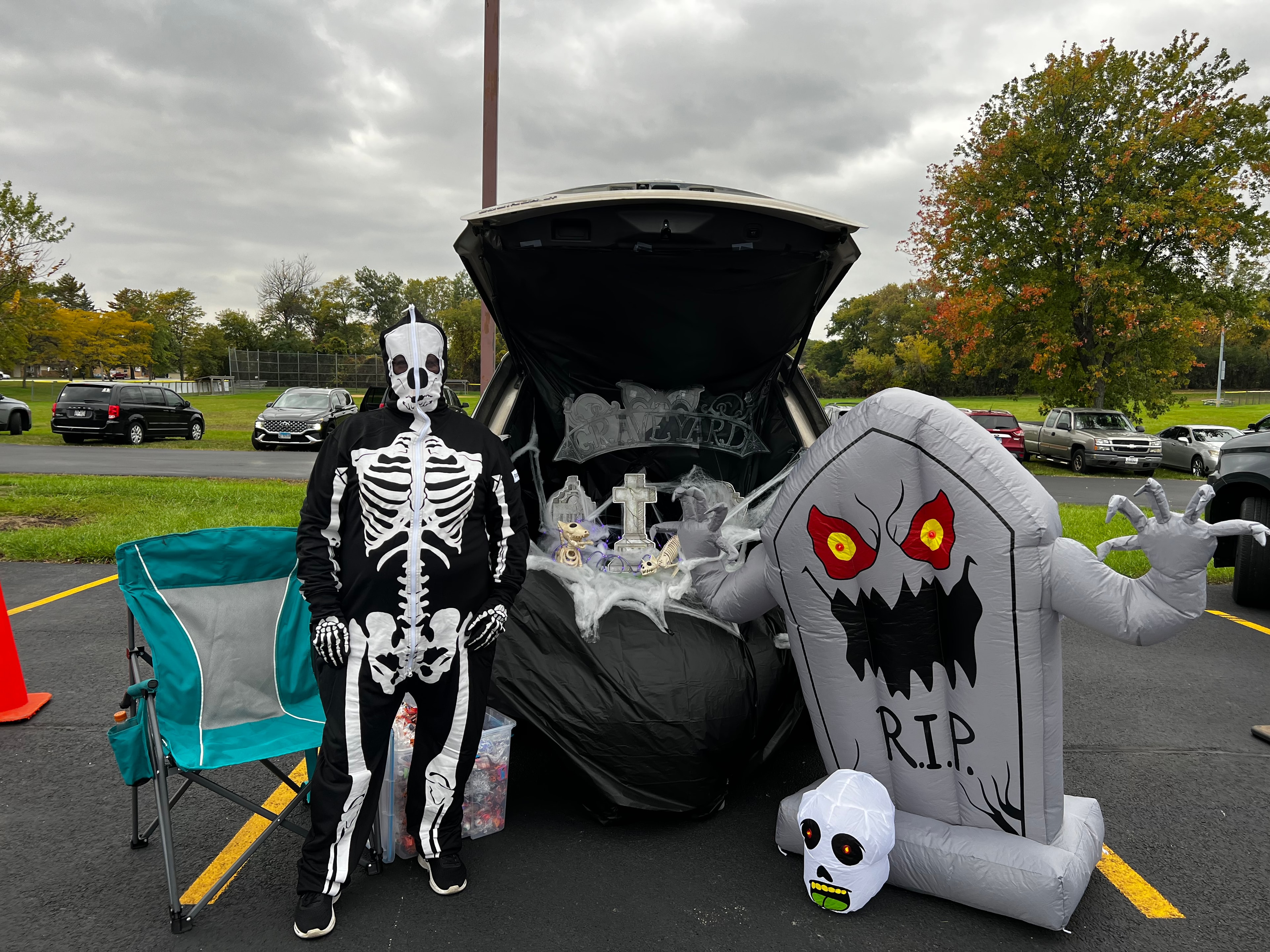 Skeleton costume with graveyard trunk